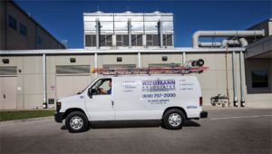 Wiegmann Associates van in front of commercial HVAC service facility