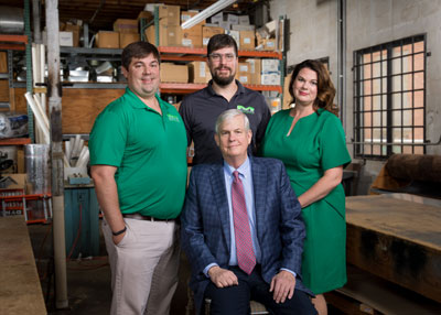 Moncrief Heating and Air Conditioning President and CEO Frank Mutz (seated) is passing his legacy of service to his children, the fifth generation to work in the family business. Standing (from left) sons Tom, Vice President of Customer Service, and Phil, Vice President of Technical Service and daughter, Amanda Mutz Wolski, Vice President of Marketing.