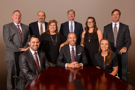 Seated (left-right) Joe Carboni, Steve Carboni, Debbie Henderson. Standing (left-right) Matt Reiners, Kraig Miller, Mitzi Kennedy, Roger Daniel, Courtney Sanders, Matt Cooley.