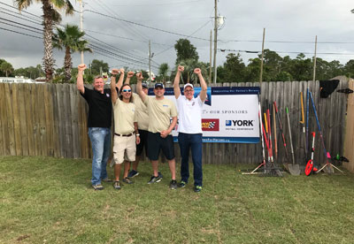 Teams from YORK, M&A Supply and Building Homes for Heroes volunteer to landscape the home.