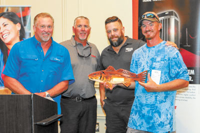 1st Place trout and redfish angler Brian Kozak (far r.) with MC Mark Hurm, Chris Winkel and John Daly of prize sponsor Baker Distributing/Florida Cooling Supply