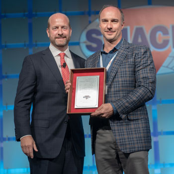 Tom Martin (right), President of T.H. Martin, Inc., was named 2018 SMACNA Contractor of the year.