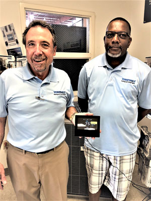 Tommy Flick and James Trotter with the Ion thermostat