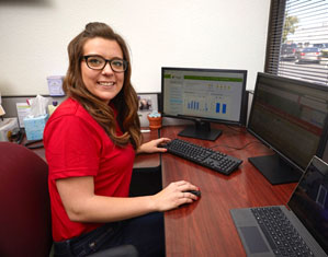 Rebecca Gladden, IES energy engineer, remotely controls thermostats at 50 school districts.