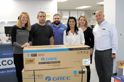 Susanne Sanchez of Tradewinds, 18,000 BTU/H Gree ductless system winner Daniel Gorra of Test and Balance, Alfredo Toste of Gemaire, Tatiana Carbonell of Tradewinds and Kristina Poakeart and Alex Amigorena of Gemaire.