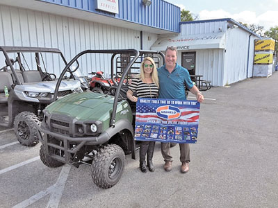 Charlene Ierna of Ierna’s Heating and Cooling and Pete Berberich of CE with the Kawasaki Mule .