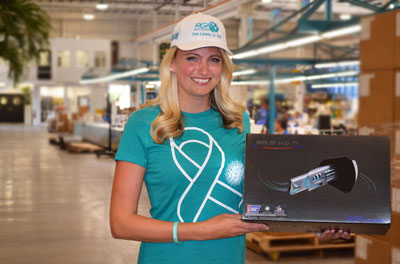 RGF's Angela Solland holds REME HALO® box at their manufacturing plant in Florida.
