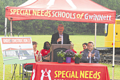 Left to right: Susie Collat, Special Needs Schools of Gwinnett (SNS), board member Mark Kuntz (speaking), Mitsubishi Electric HVAC US (METUS), CEO Mike Maloney, Special Needs Schools of Gwinnett, incoming Board President.