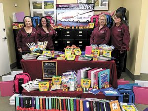 Picture (left to right): Nebrasky employees Michelle Ross, Leeanne Rose, Judy Yates and Eileen Barclay with the donated school supplies.