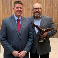 AIM/R presents Golden Eagle Award to Elkay EVP Mark Whittington