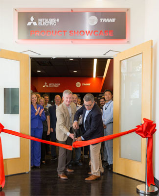 Mark Kuntz, chief executive officer, and Brinnon Williams, senior director, residential channel development, officially open the METUS Product Showcase room.