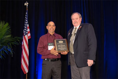 Tony DeSantis, left, receives HVAC Instructor of the Year award from PHCC President Ken Nielsen.