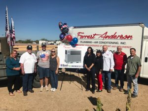 Forrest Anderson Plumbing and AC gives new AC unit to veteran Dan and Brenda Dennison (third and fourth from left).