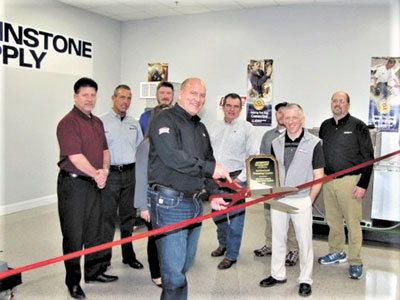 David Laxton, President, Johnstone J-Team, James Tedesco, JCI Factory Technical Instructor and team members Ribbon Cutting Ceremony.