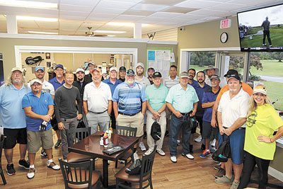 The GACCA golfers gather before going out into the elements.