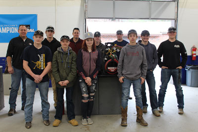 Timothy Reading, Harris Products Group District Manager (far left in back row), and Chris Crooke, HVAC/R Teacher with Grayson County Public Schools (third from left in back row), pose with the students from Grayson County High School.