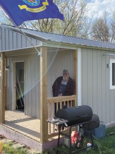 Navy veteran Rick Lewis outside his new home.