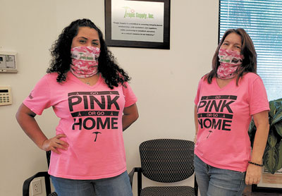 Jessica Esmurria and Jennifer Conception of Tropic Supply rocking their cancer awareness month camo neck buffs and t-shirts.