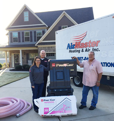 Pictured with the Owens Corning Pro-Cat Professional Loosefill Insulation System is: Nicole Montoleone, District Sales Manager for Owens Corning; Bill Eaton, Regional Sales Manager for East Coast Metal Distributors, Inc.; and Gary Presti of Air Master Heating & Air Inc.