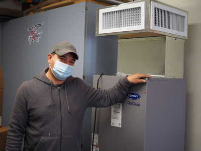 Jorge Rodriguez, custodian at McParland School in Manteca Unified School District, with the district’s first delivered OptiClean unit