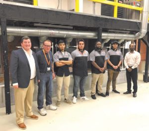 Tucker Green (far left) Executive Director for the Conditioned Air Association of Georgia (CAAG) with group at Altierus Career College