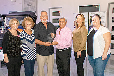 Pat (2nd from l.) and Frank (4th from l.) DiBenedetto are presented with the Pelican Aire Ultimate Long Hauler Award by JoAnne and Rick Houghton and their daughters, Andrea Houghton and Renee Pagan