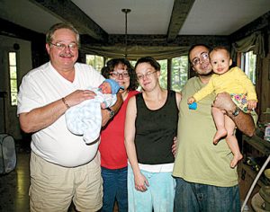 Fred Martel (left) with family