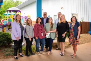 Harris Products Group presented a $25,000 donation to Sisu in May. Pictured from left are Amy McMillan, Michelle Kuhrt, Carla Baker, Greg Doria (president of Harris), Daphaney Teaver, Melissa Nolan and Gloria Farrell. Baker, Teaver and Farrell are Sisu employees.