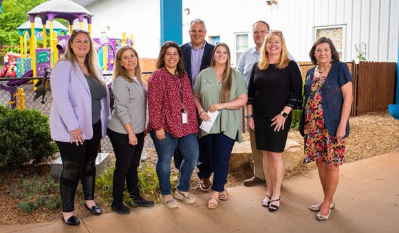 Harris Products Group presented a $25,000 donation to Sisu in May. Pictured from left are Amy McMillan, Michelle Kuhrt, Carla Baker, Greg Doria (president of Harris), Daphaney Teaver, Melissa Nolan and Gloria Farrell. Baker, Teaver and Farrell are Sisu employees.