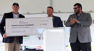 L to R: Tunnel to Towers Foundation representative Andrew McClure receives a check for $25,000 from Taco Comfort Solutions’ Benjamin White, Manager, Supply Chain, and John White, III, Sr. Vice President, OEM Sales